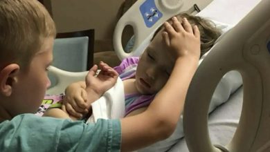 Photo of The story behind a heartbreaking image of a 6-year-old boy saying goodbye to his dying sister