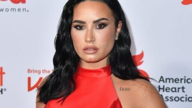 Photo of Demi Lovato Goes from Dramatic Gown to Rocking Red Suit for AHA Red Dress Concert Performance