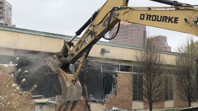 Photo of Neighbors at Odds Construct a Wall Along Their Property Boundary, Awaken to the Sound of a Bulldozer One Morning