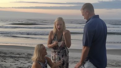 Photo of At the beach with my husband, a woman approached, knelt down, and called out his name