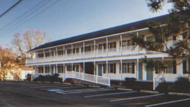 Photo of A Woman Catches Her Husband Leaving a Motel with Another Woman Looking Disheveled – A Day to Remember